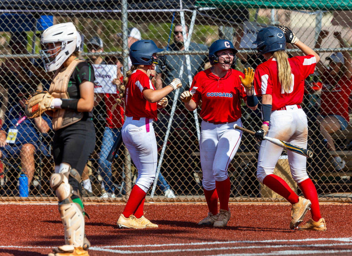 Coronado players celebrate another score agaoinst Palo Verde during the fourth inning of their ...