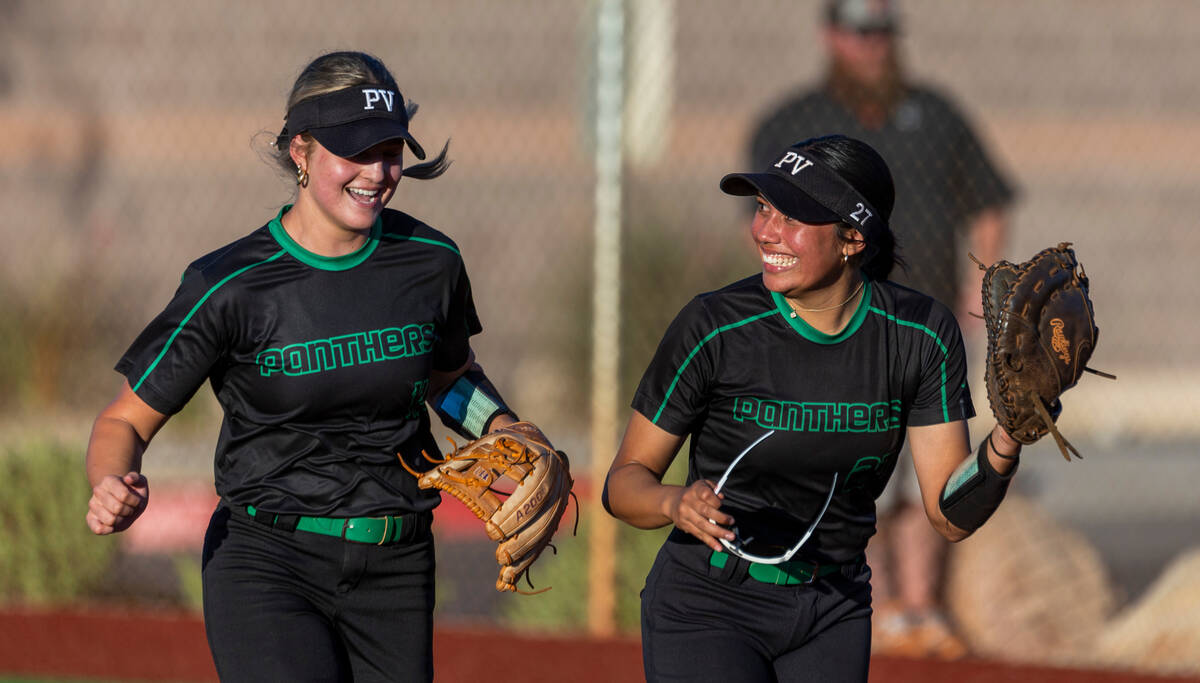 Palo Verde infielders Taylor Johns (11) and Zoe Helein (27) have some fun while running off the ...