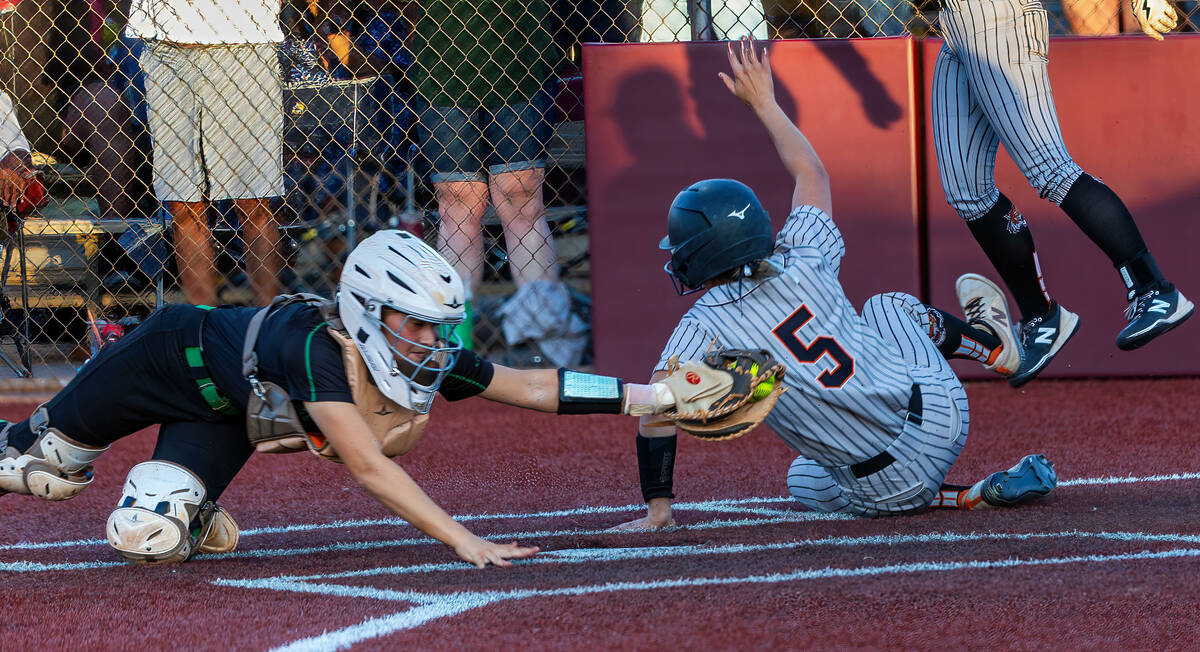 Palo Verde catcher Madi Malloy (3) is unable to make a tag in time as Douglas runner Ava Delane ...