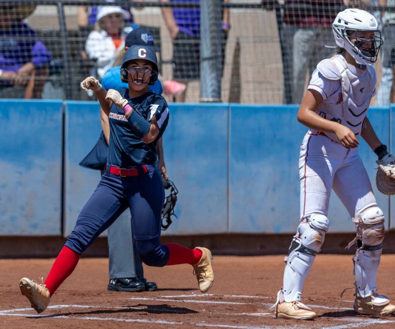 Coronado runner Alohi Mundon (8) celebrates a score over Douglas during the first inning of the ...