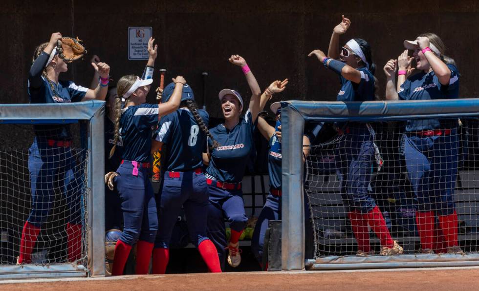 Coronado runner Alohi Mundon (8) and teammates celebrate a score over Douglas during the first ...