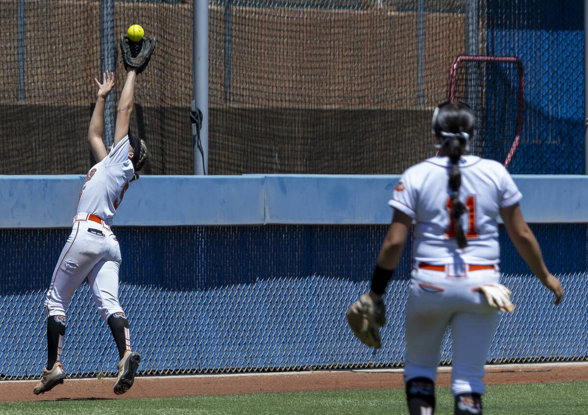 Douglas outfielder Ava Delaney (5) extends for a great catch against Coronado during the first ...
