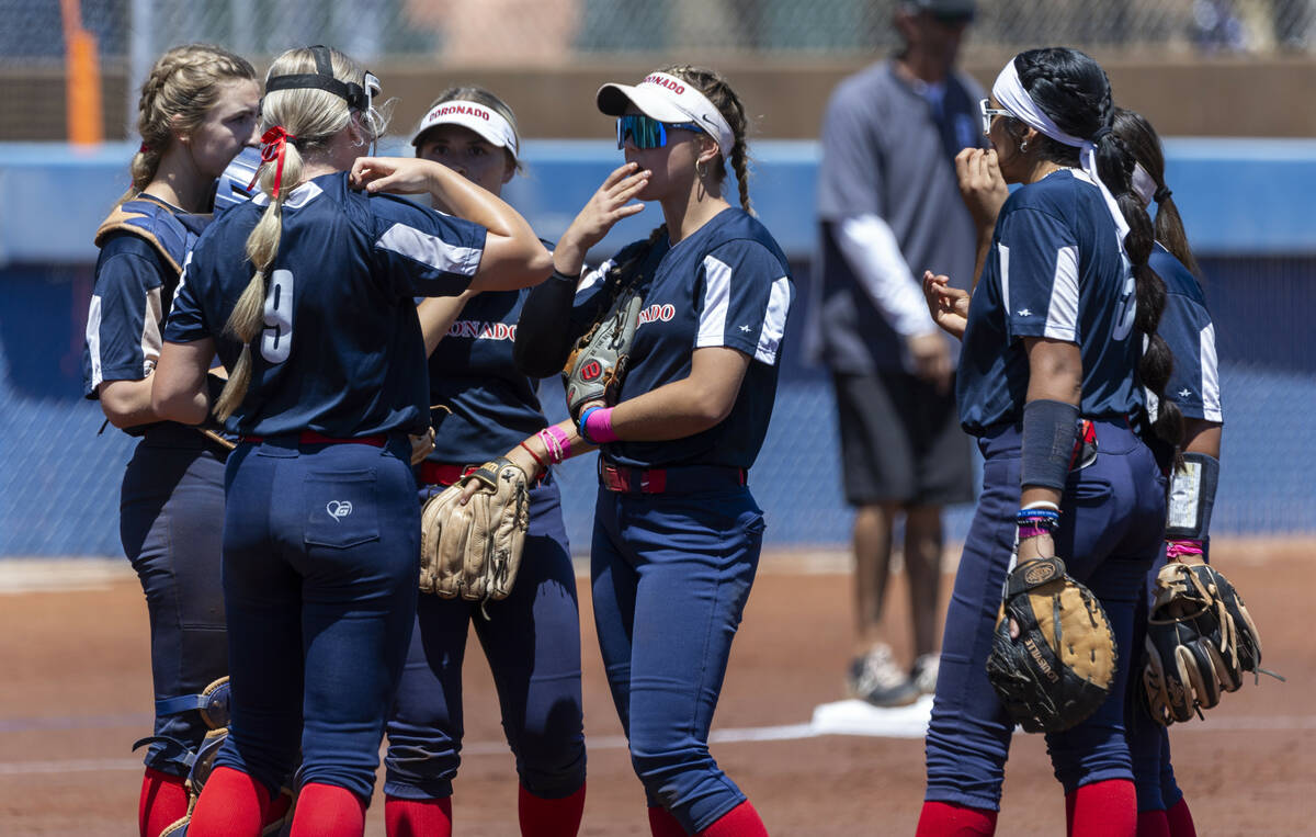 Coronado players come together on the mound for a talk against Douglas during the first inning ...