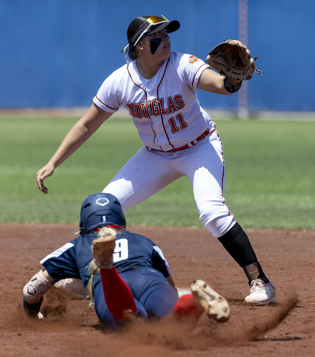 Coronado runner Kendall Selitzky (9) slides safely into second base as the throw is late to Dou ...