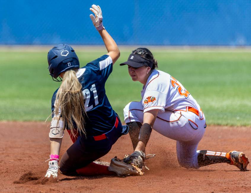 Coronado runner Charlotte Bendlin (21) slides safely into second base as the tag is late by Dou ...