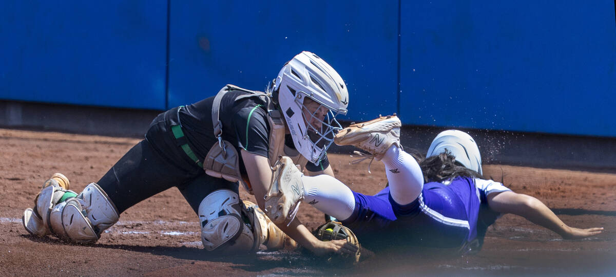 Spanish Springs runner (5)slides in safely at home plate against Palo Verde catcher during the ...