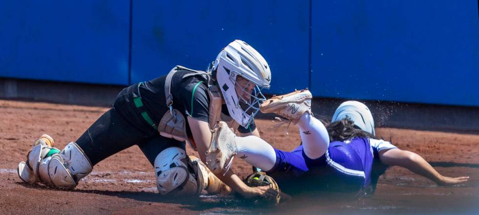 Spanish Springs runner (5)slides in safely at home plate against Palo Verde catcher during the ...