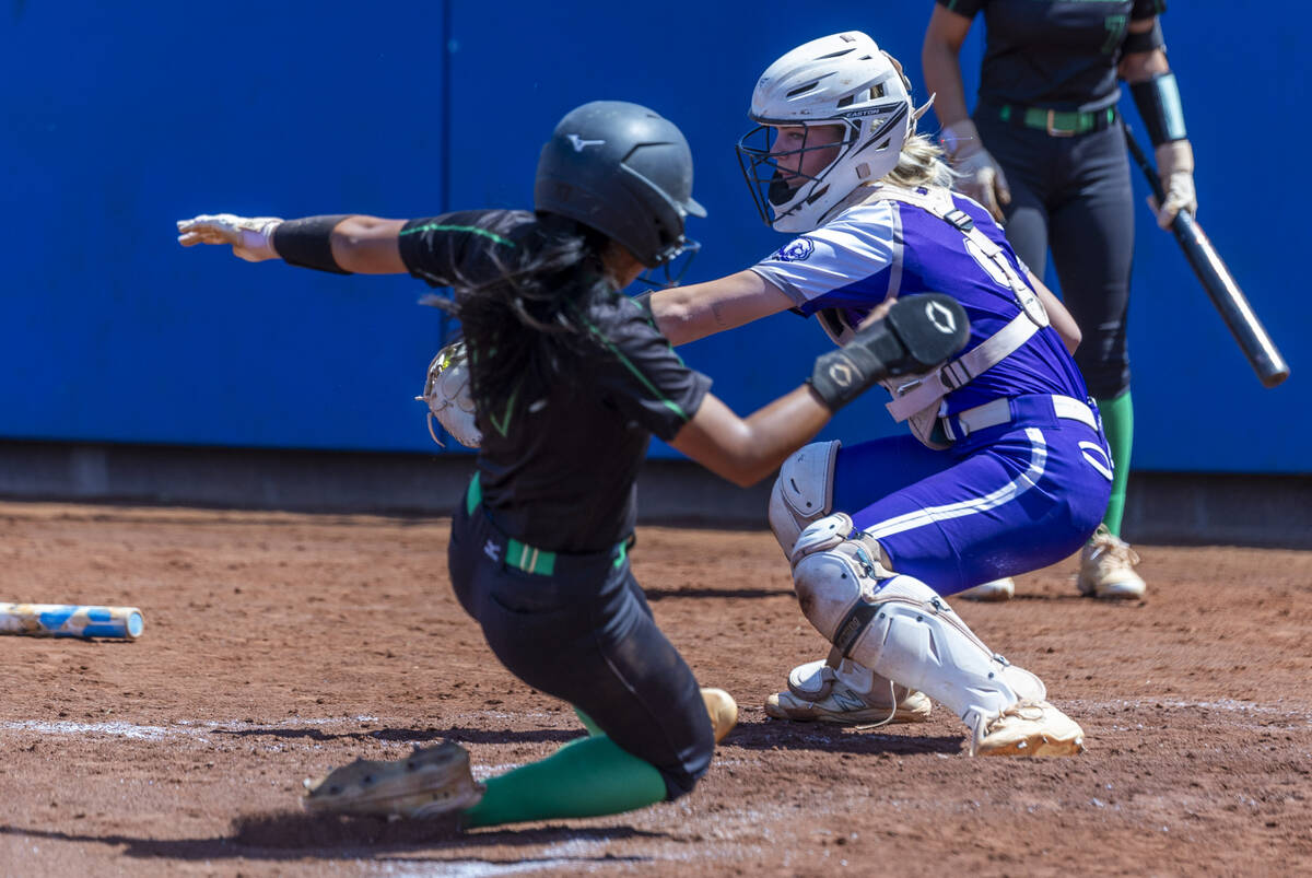Palo Verde runner Alexis Kearnes (7) attempts to score at home plate past Spanish Springs catch ...