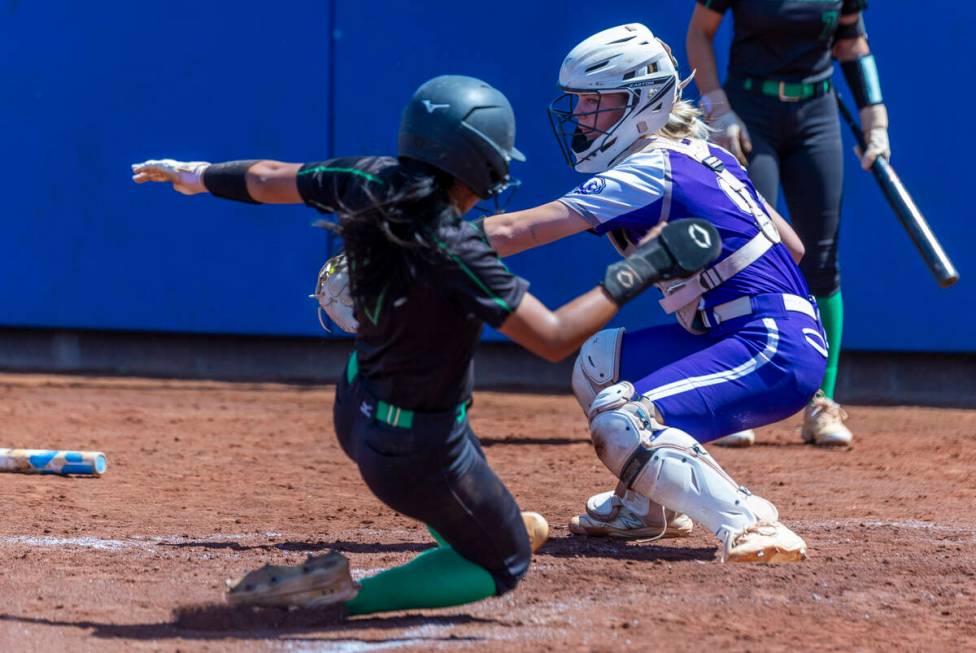 Palo Verde runner Alexis Kearnes (7) attempts to score at home plate past Spanish Springs catch ...