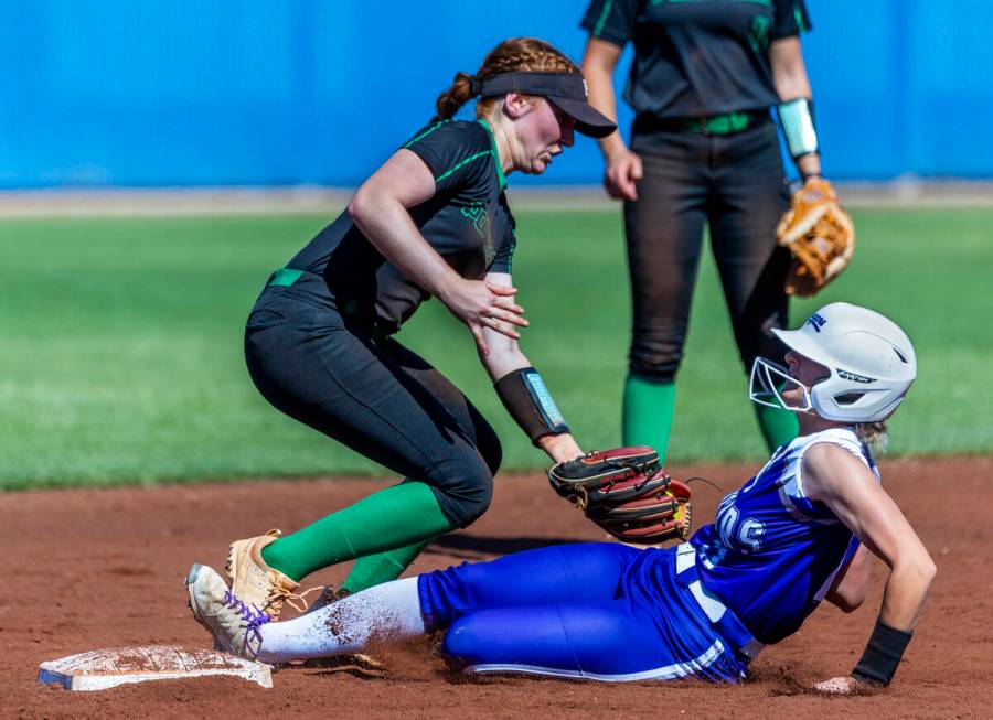 Palo Verde infielder Mya Bartlett (18) attempts a tag at second base as Spanish Springs runner ...