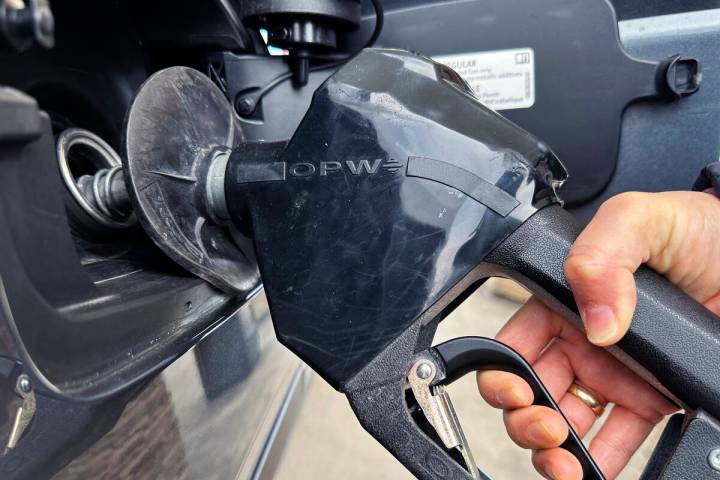 A customer pumps gas at a gas station in Mundelein, Ill., Feb. 8, 2024. (AP Photo/Nam Y. Huh, file)