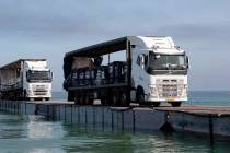 Trucks loaded with humanitarian aid from the United Arab Emirates and the United States Agency ...