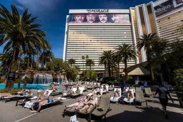 Guests lounge by the pool at The Mirage on Saturday, March 6, 2021, in Las Vegas. (Las Vegas Re ...