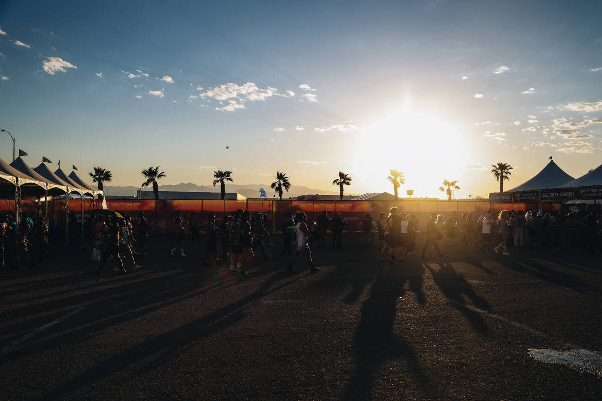 Festival attendees walk through the gates during day one of Electric Daisy Carnival at the Las ...