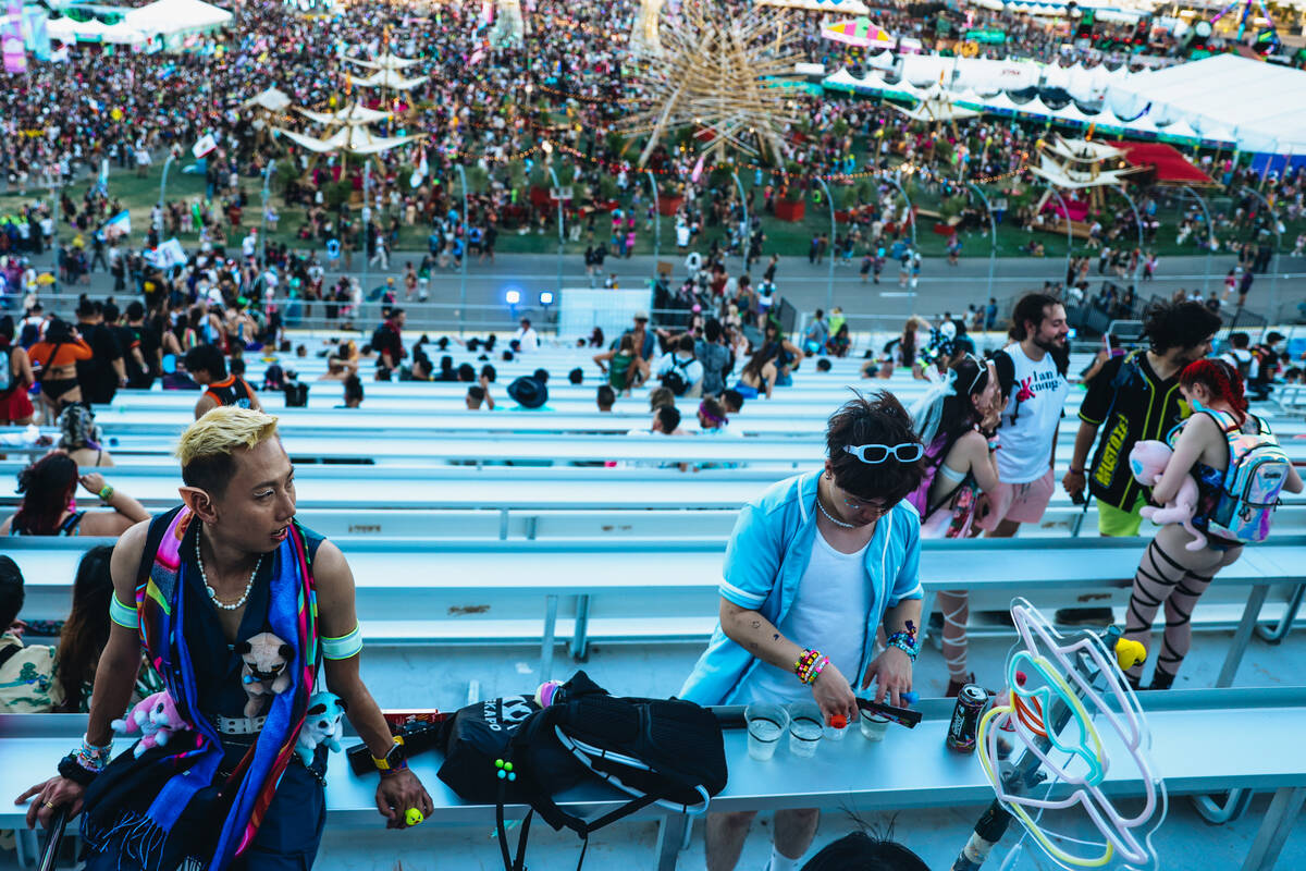 Festival attendees sit on the bleachers during day one of Electric Daisy Carnival at the Las Ve ...