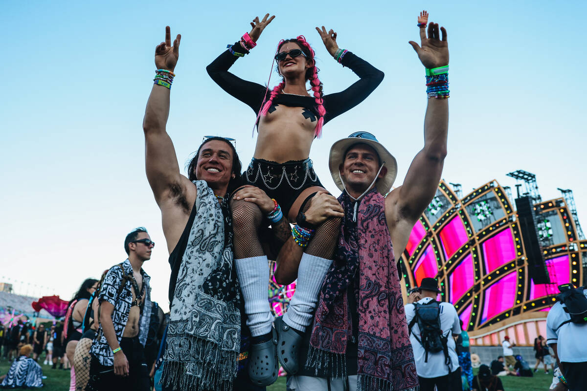 Festival attendees pose for photographs during day one of Electric Daisy Carnival at the Las Ve ...