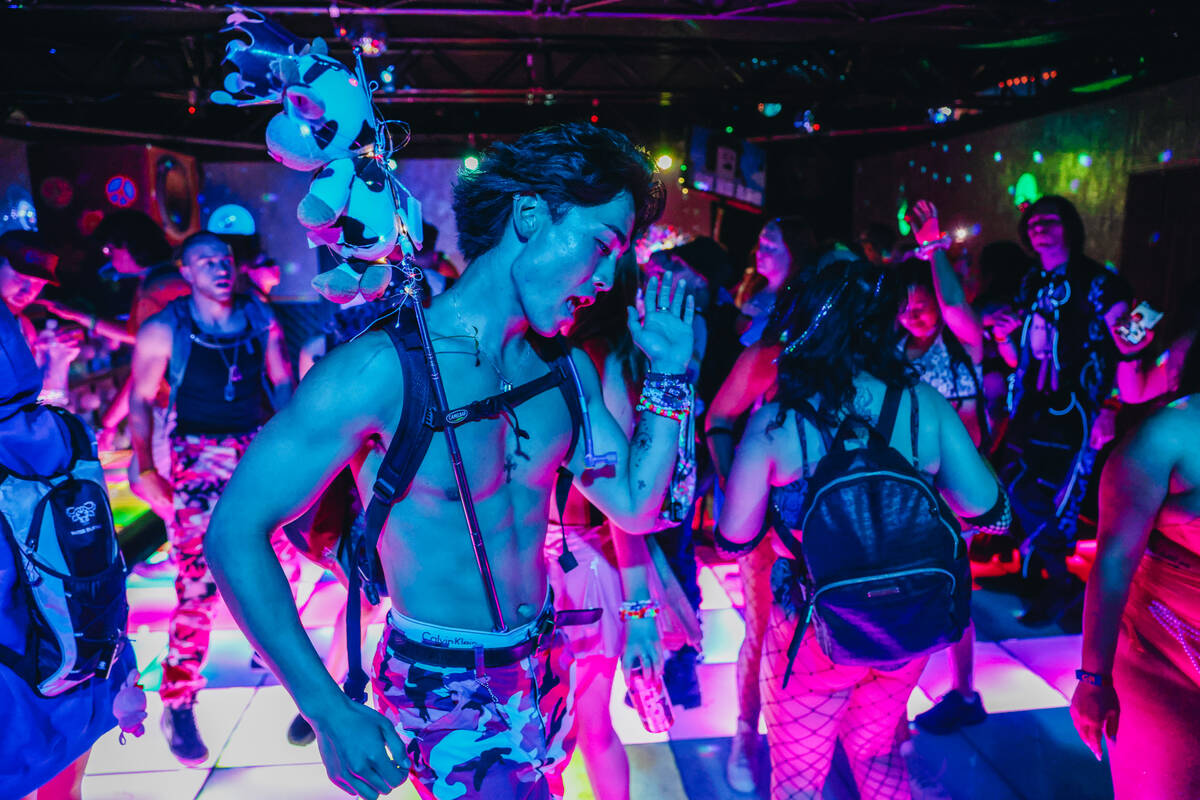 EDC attendees dance during day one of Electric Daisy Carnival at the Las Vegas Motor Speedway o ...