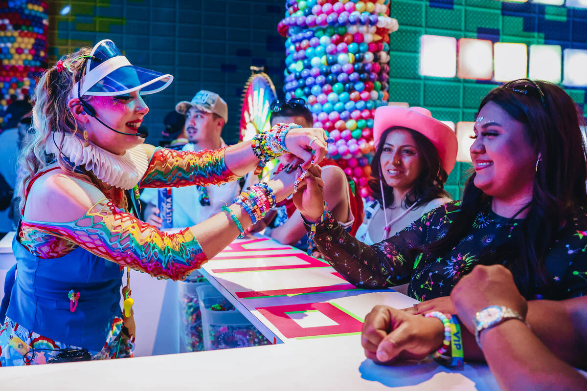 EDC attendees are given bracelets during day one of Electric Daisy Carnival at the Las Vegas Mo ...