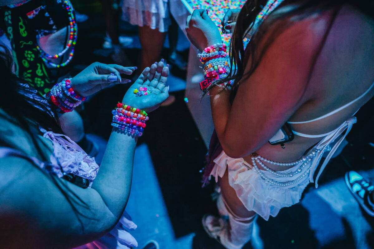 EDC attendees make kandi bracelets during day one of Electric Daisy Carnival at the Las Vegas M ...