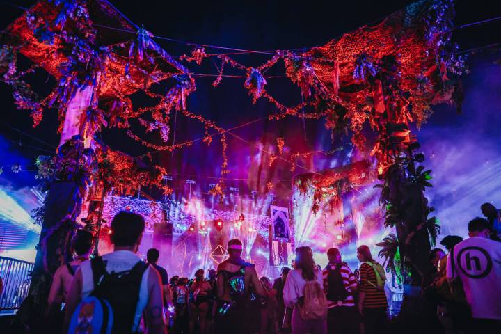 EDC attendees walk to a DJ set during day one of Electric Daisy Carnival at the Las Vegas Motor ...