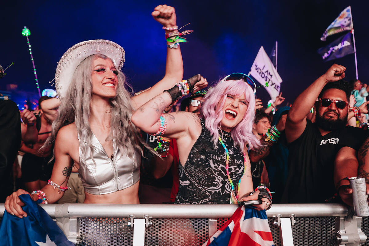 EDC attendees dance during a DJ set on day one of Electric Daisy Carnival at the Las Vegas Moto ...