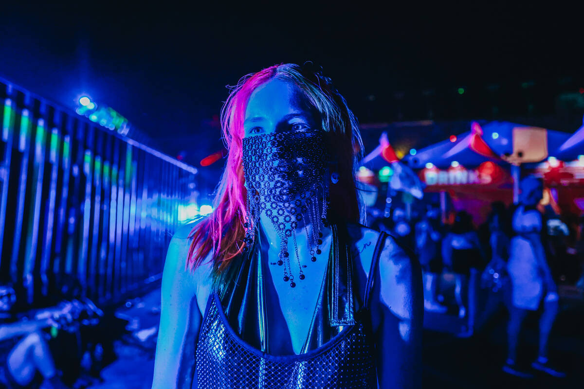 A festival attendee wears a beaded mask during day one of Electric Daisy Carnival at the Las Ve ...