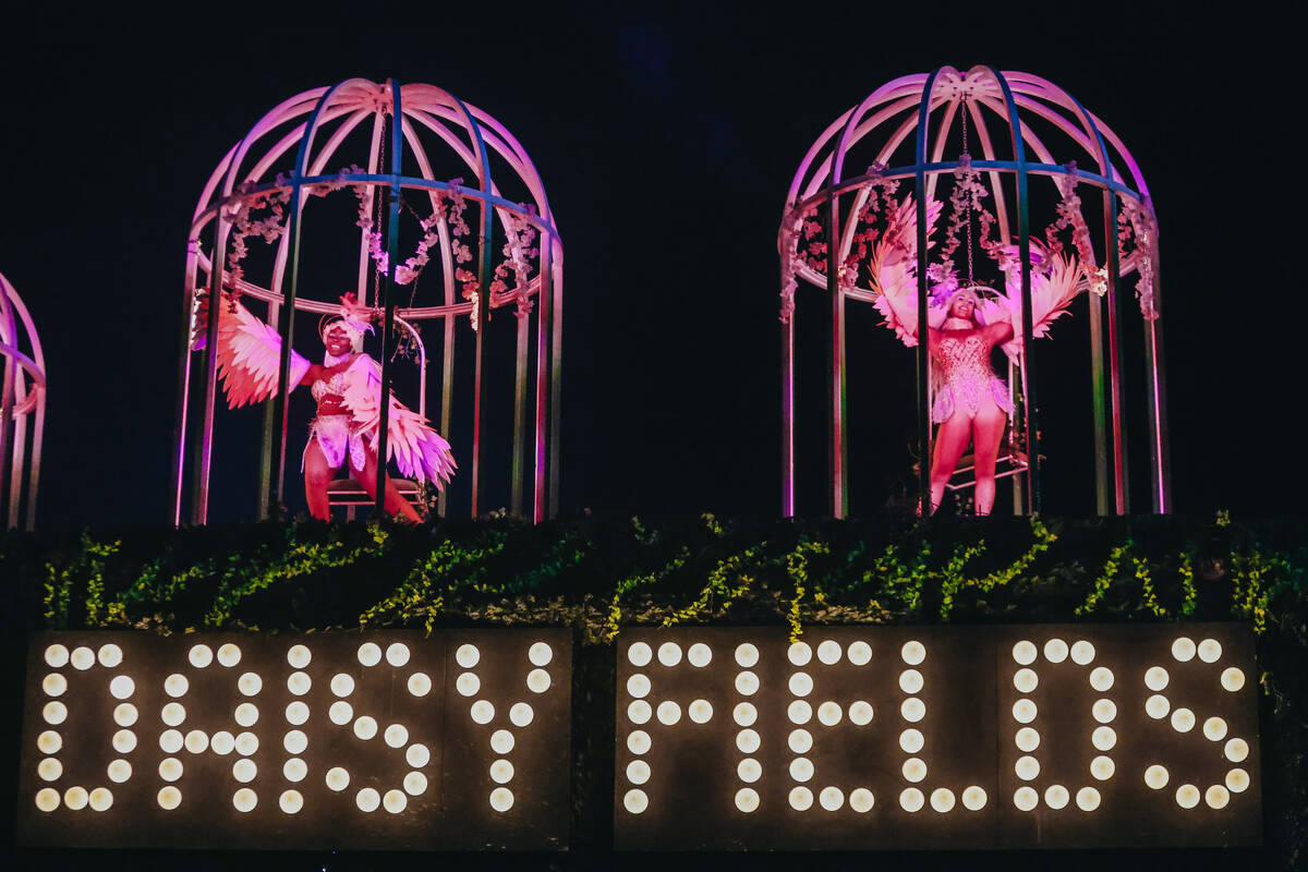 Performers welcome the crowds inside of Daisy Fields during day one of Electric Daisy Carnival ...