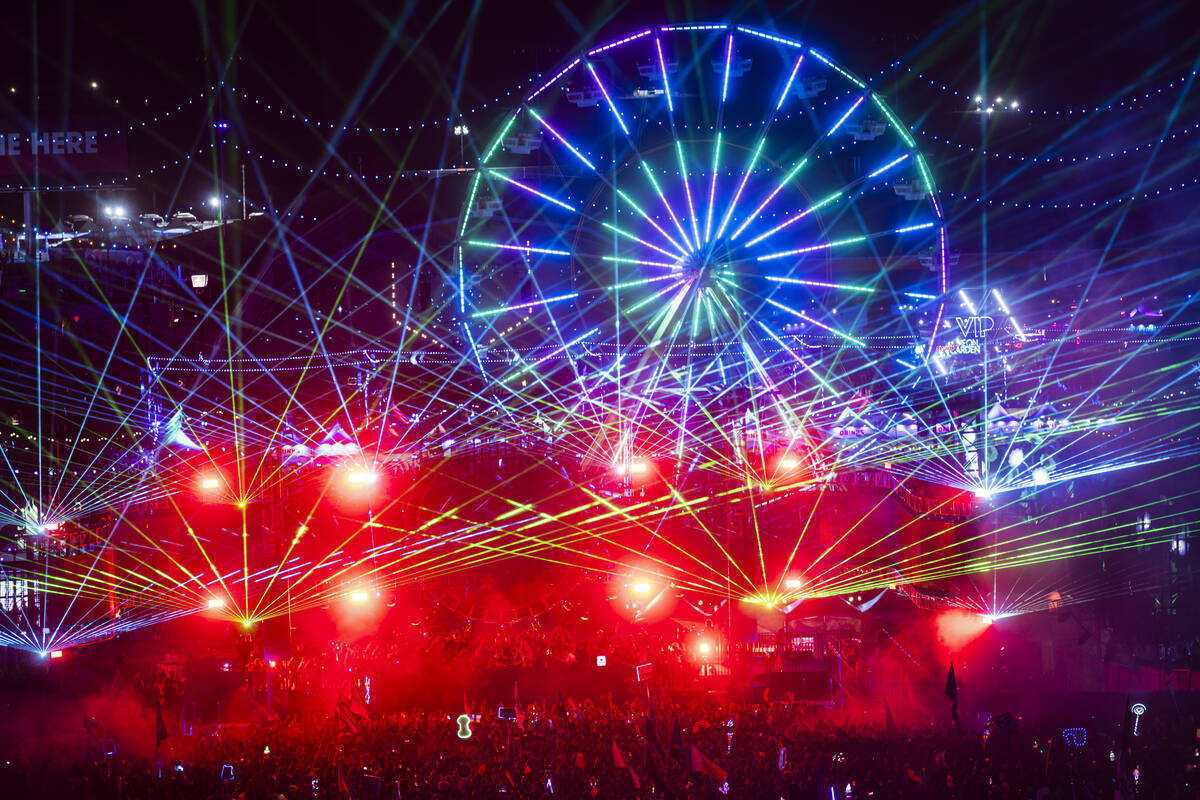 Lasers light up the sky during the first night of the Electric Daisy Carnival at the Las Vegas ...