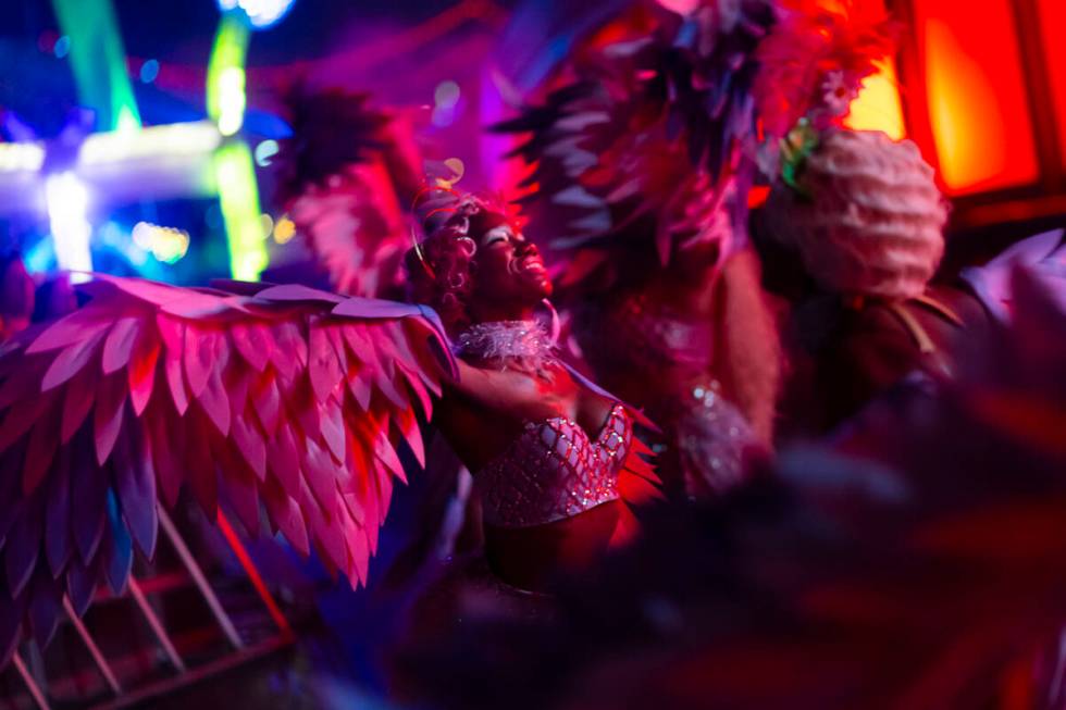 Costumed performers entertain the crowd at the Cosmic Meadow stage during the first night of th ...