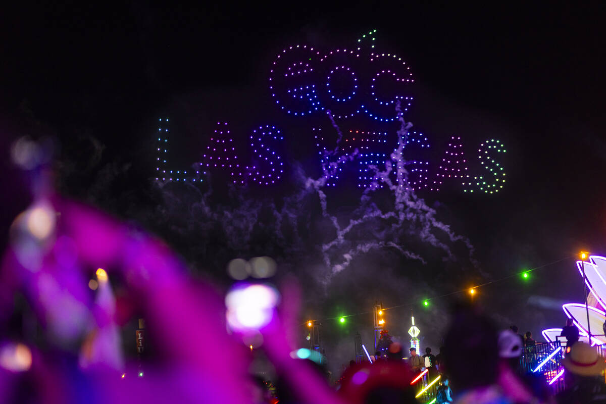 Drones light up the sky in a display during the first night of the Electric Daisy Carnival at t ...