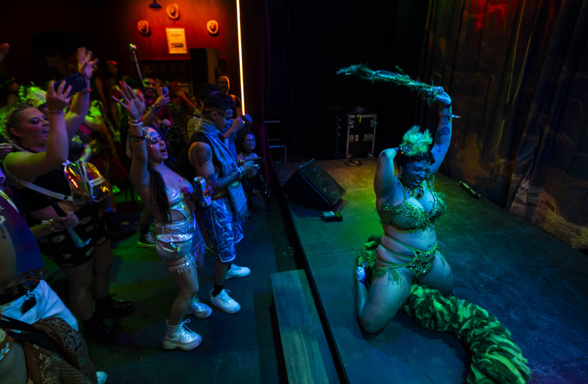Burlesque performer Elyse Elaine entertains the crowd during the first night of the Electric Da ...