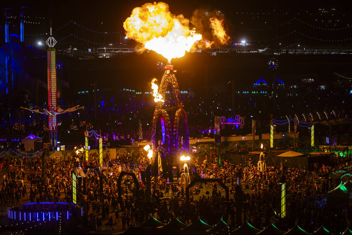 Pyrotechnics light up the Flower Tower installation during the first night of the Electric Dais ...
