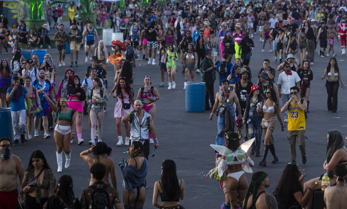 Festival attendees make their way towards the exits at sunrise on the close of the second night ...