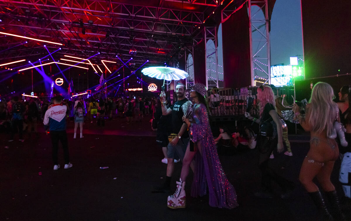 Festival attendees walk by during the second night of the Electric Daisy Carnival at the Las Ve ...
