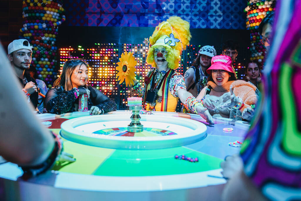 A group plays a game inside of the Kandi Casino during the second day of the Electric Daisy Car ...