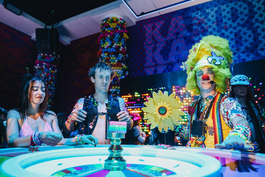 A group plays a game inside of the Kandi Casino during the second day of the Electric Daisy Car ...
