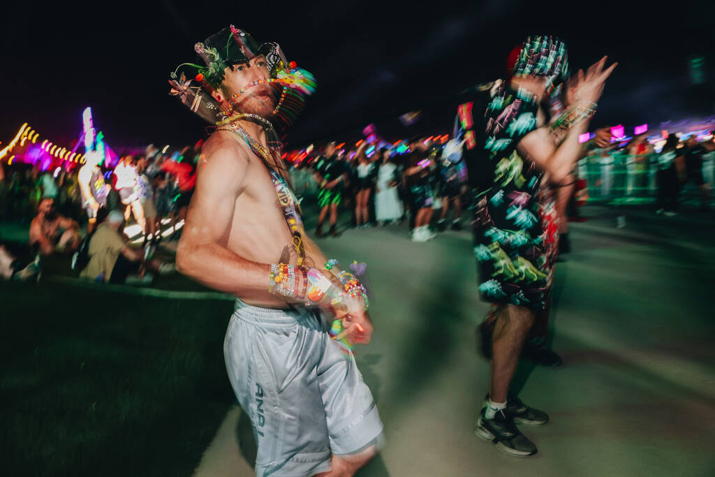 Festival attendees dance to a DJ set during the second day of the Electric Daisy Carnival at th ...