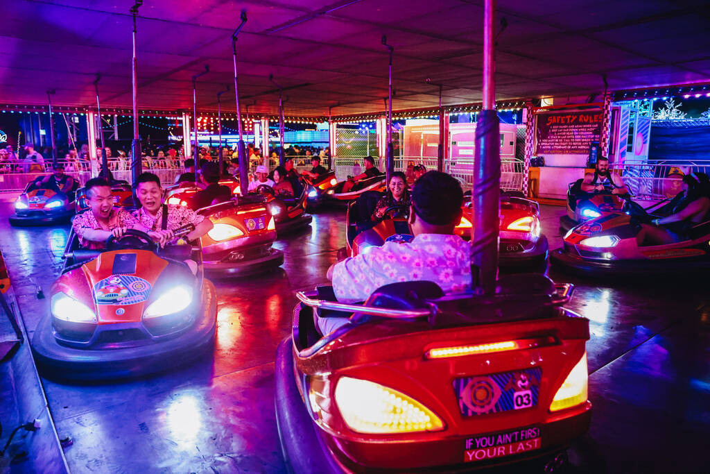 People play on bumper cars during the second day of the Electric Daisy Carnival at the Las Vega ...