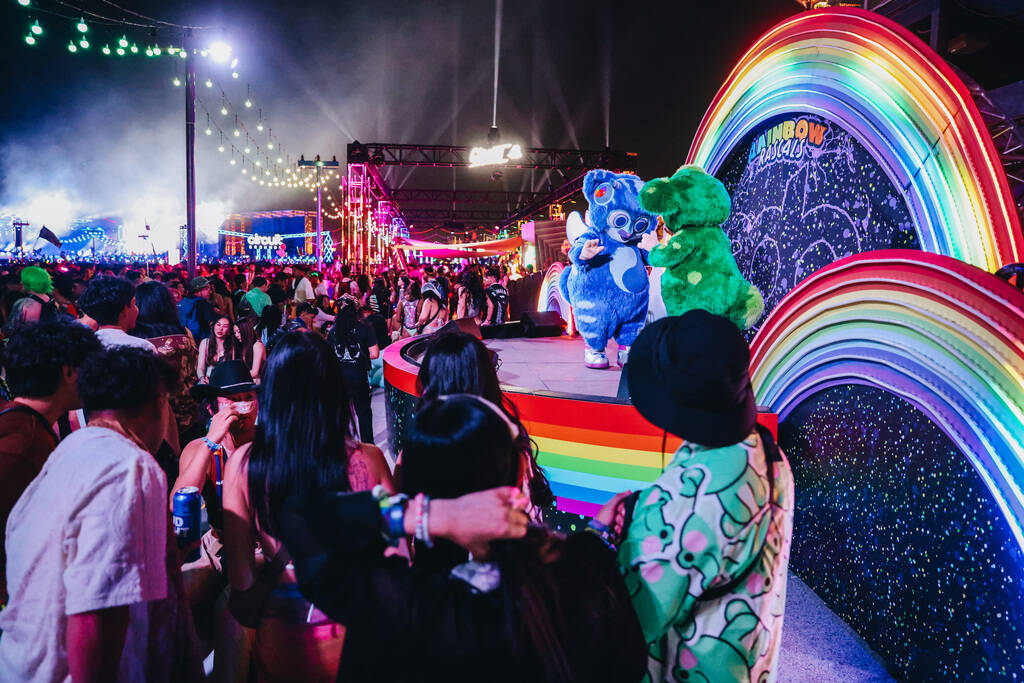 The Rainbow Rascals dance with each other during the second day of the Electric Daisy Carnival ...