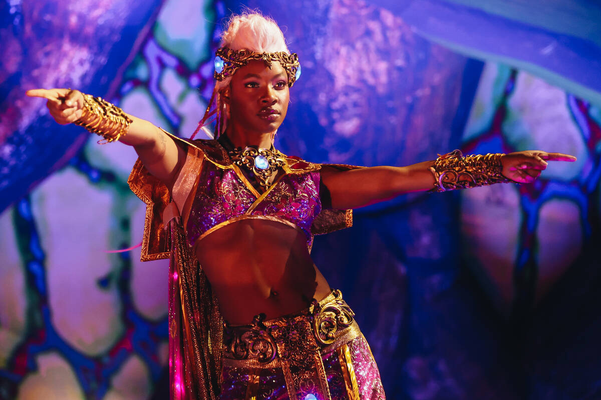 A dancer performs on stage on the third and final night of the Electric Daisy Carnival at the L ...