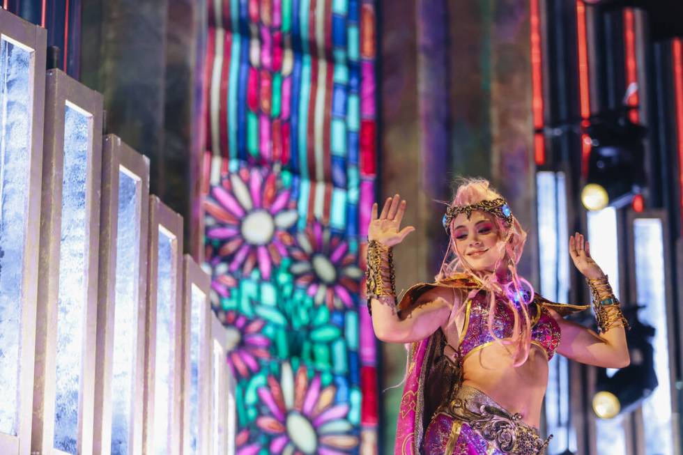 A dancer performs on stage on the third and final night of the Electric Daisy Carnival at the L ...