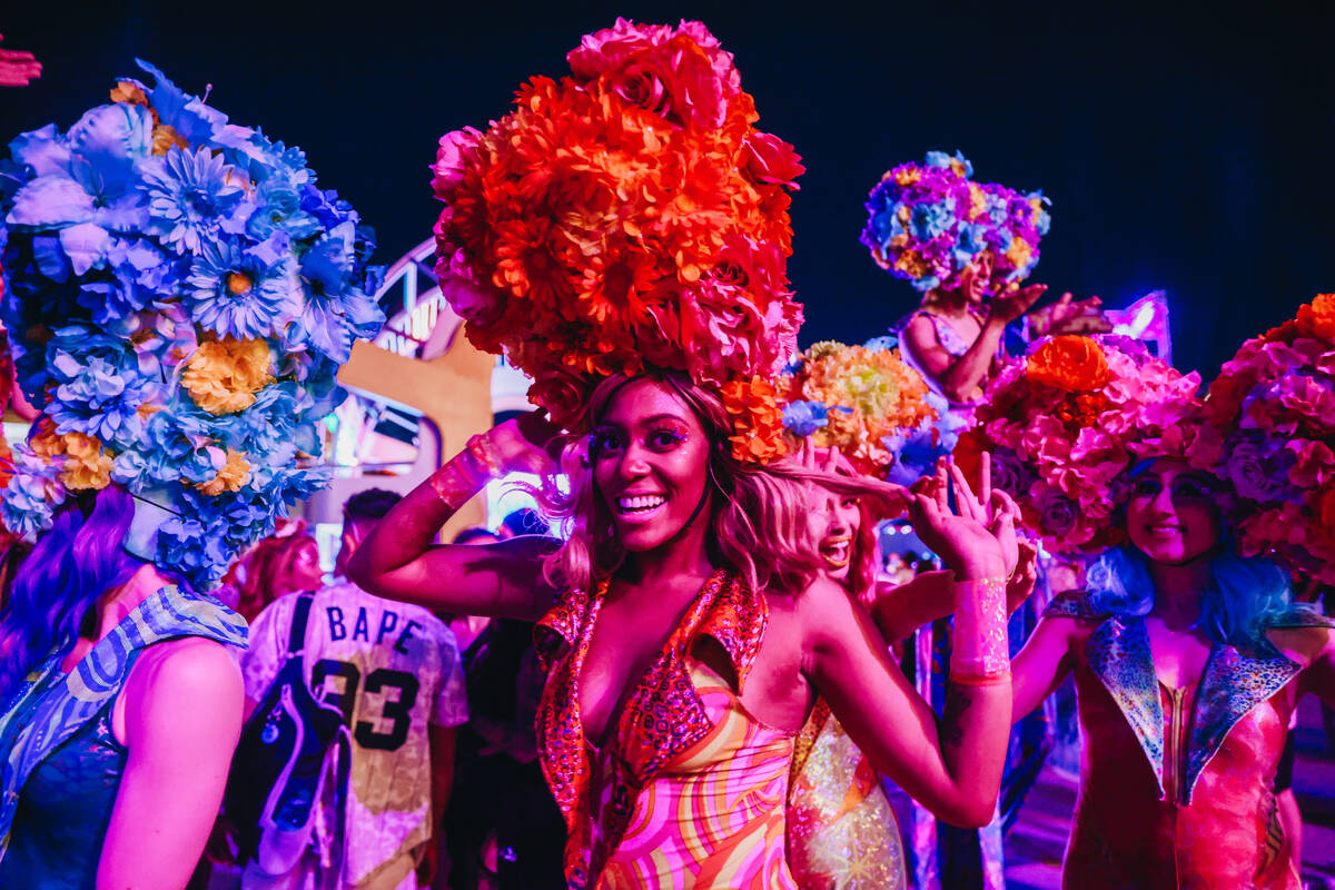 Costumed performers walk throughout festival grounds on the third and final night of the Electr ...