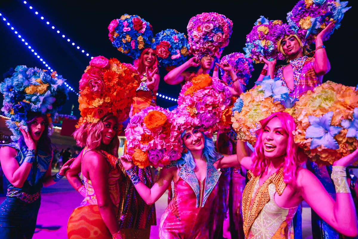 Costumed performers pose for a photograph on the third and final night of the Electric Daisy Ca ...