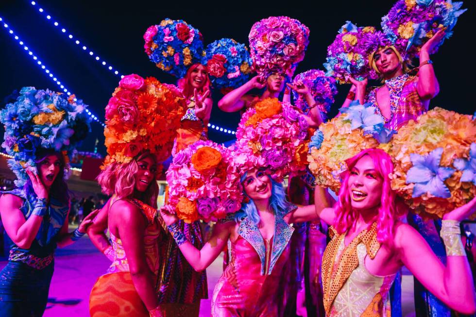 Costumed performers pose for a photograph on the third and final night of the Electric Daisy Ca ...