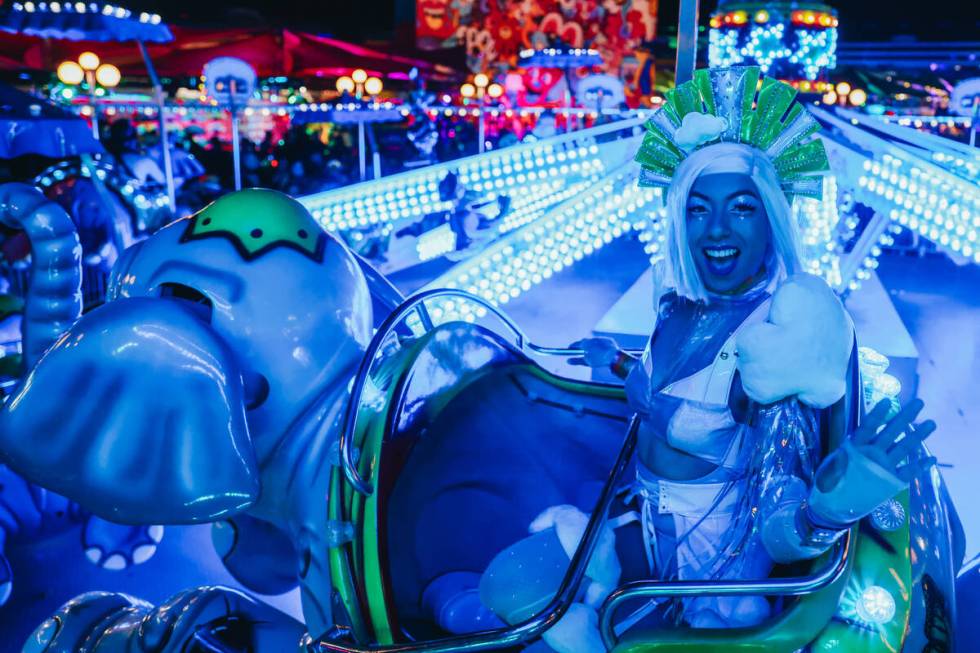 A costumed performer rides an attraction on the third and final night of the Electric Daisy Car ...