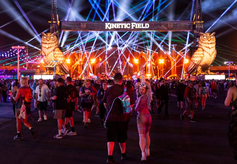 Festival attendee Rachel Hollon, of California, looks back while walking to Kinetic Field with ...