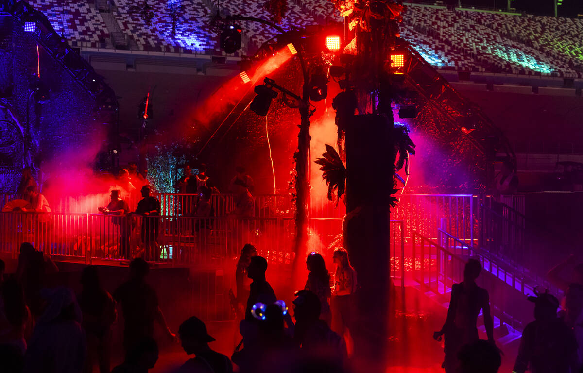 Festival attendees dance at the Bionic Jungle stage during the third night of the Electric Dais ...