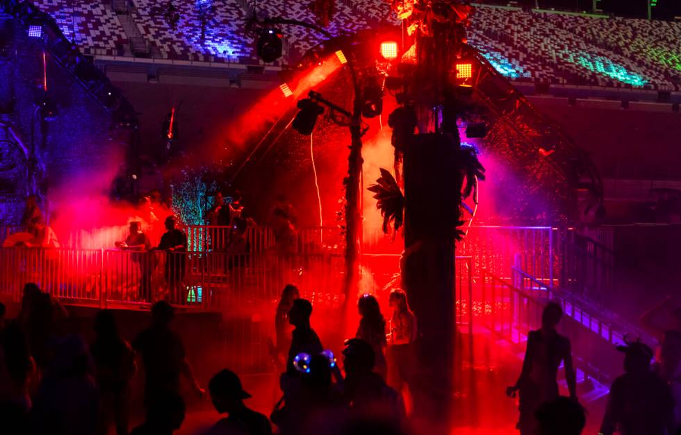 Festival attendees dance at the Bionic Jungle stage during the third night of the Electric Dais ...