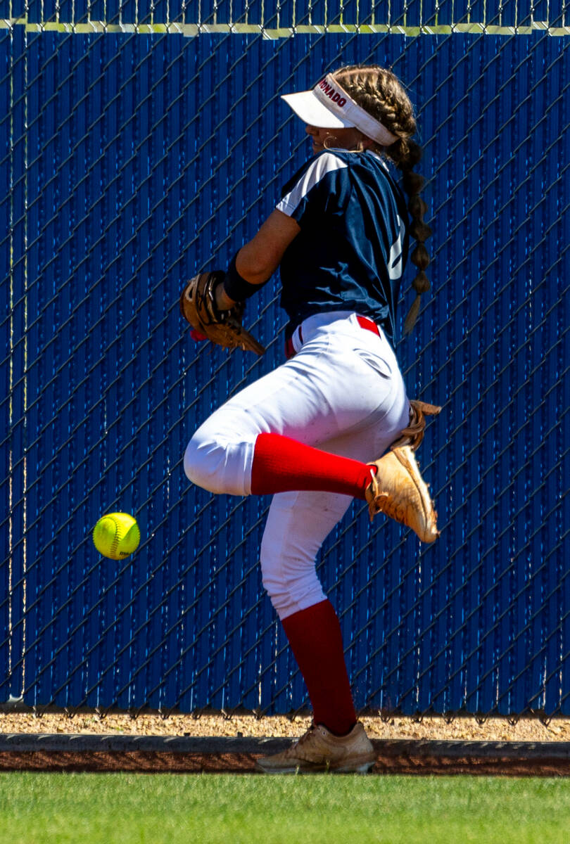 Coronado outfielder Sophie Bendlin (6) goes on the fence for an out attempt against a Douglas b ...