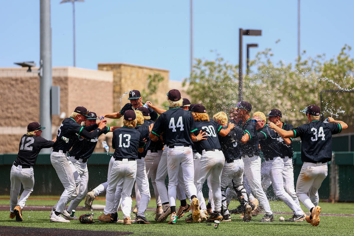 Palo Verde runs into a dog pile as they win a Class 5A baseball state title game against Reno o ...